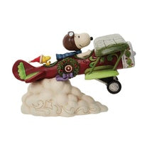 Front view of Jim Shore Snoopy Flying Ace biplane figurine showing propeller and wing detail
