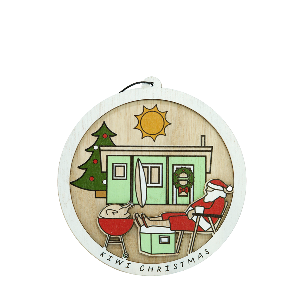 Kiwi Christmas wooden hanging ornament featuring a bach scene with Santa relaxing