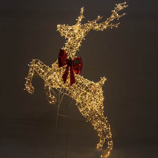 Silver wire leaping reindeer LED light figure with red bow, lit with warm white lights