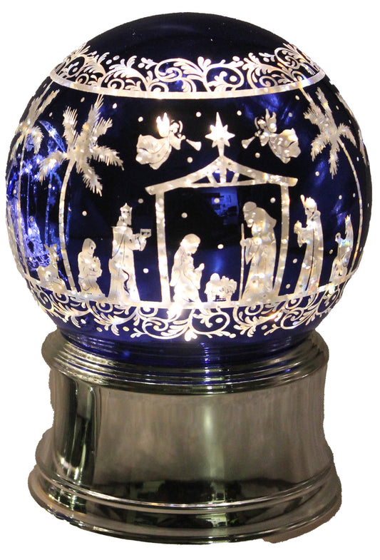 Light up nativity scene globe with blue glass, silver base, and illuminated nativity silhouette