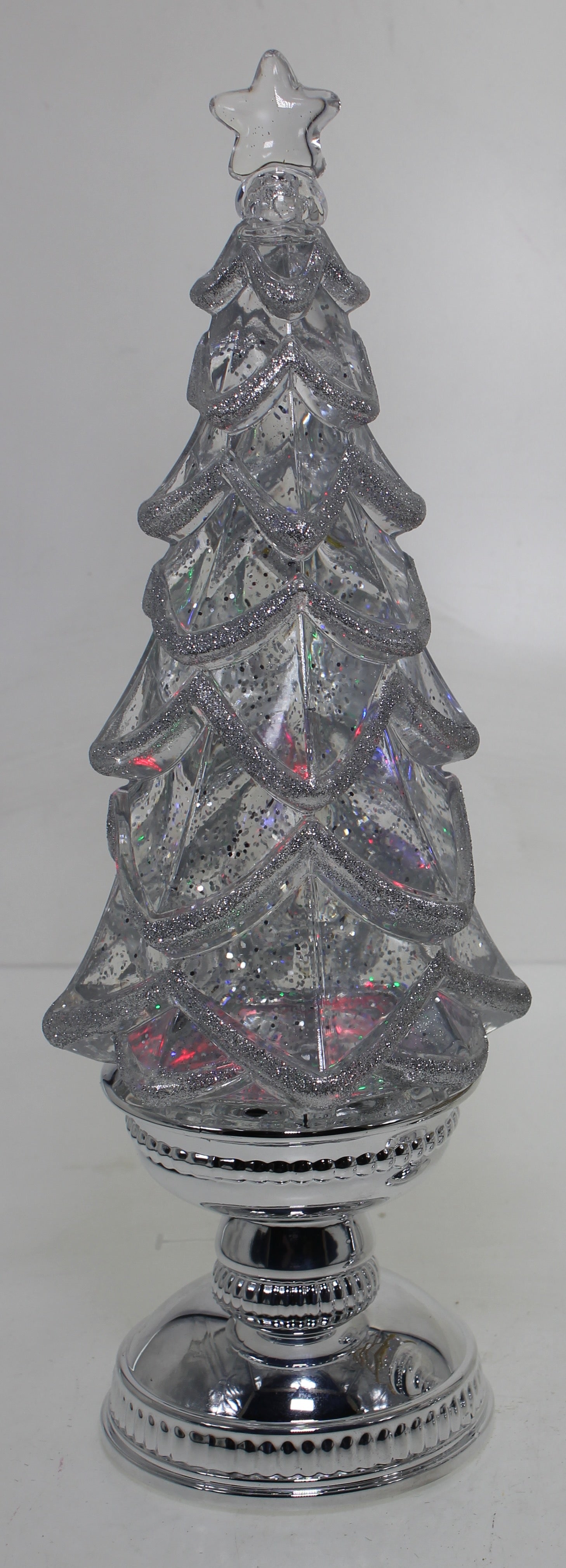 Decorative silver Christmas tree with a star on top against a white background