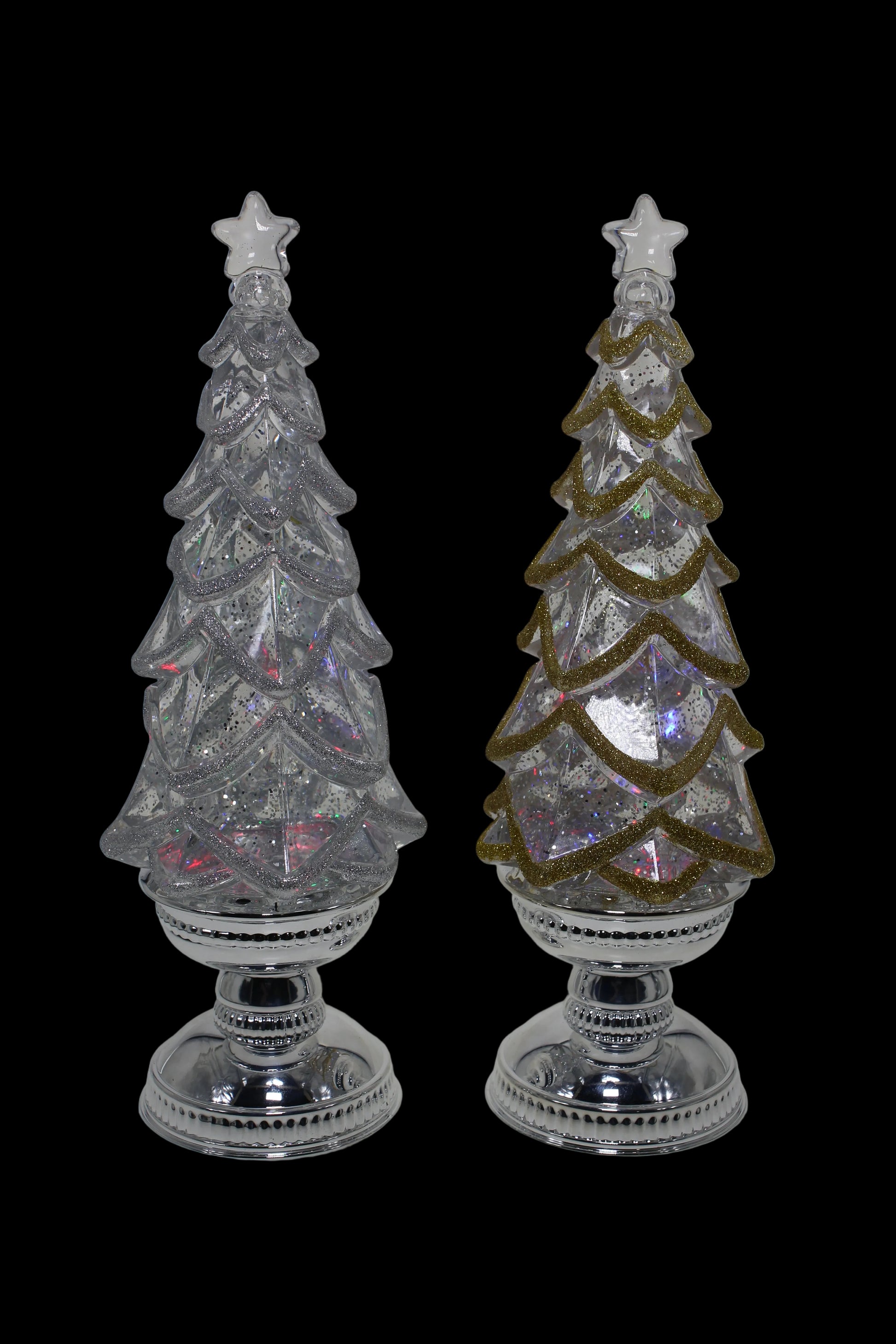 Two decorative Christmas trees with crystal-like finishes on a white background