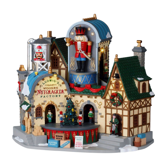 Lemax Ludwig's Wooden Nutcracker Factory village building with oversized nutcracker figurine, water tower, Tudor annexe, and mini figures 