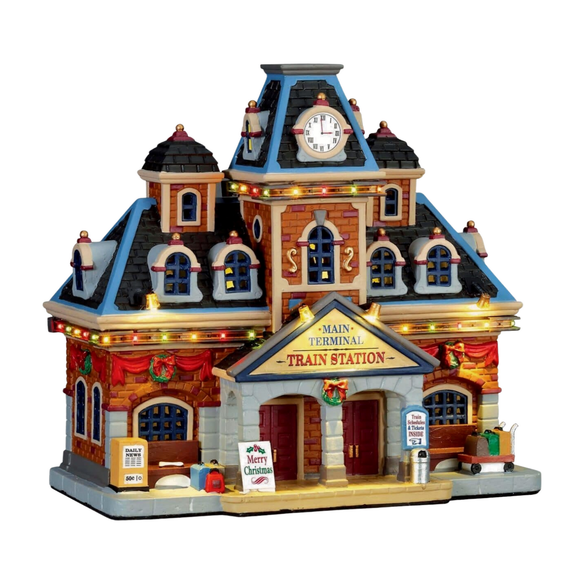 Lemax Main Terminal Train Station village building with clock tower, multicoloured lights, Christmas wreaths, and luggage