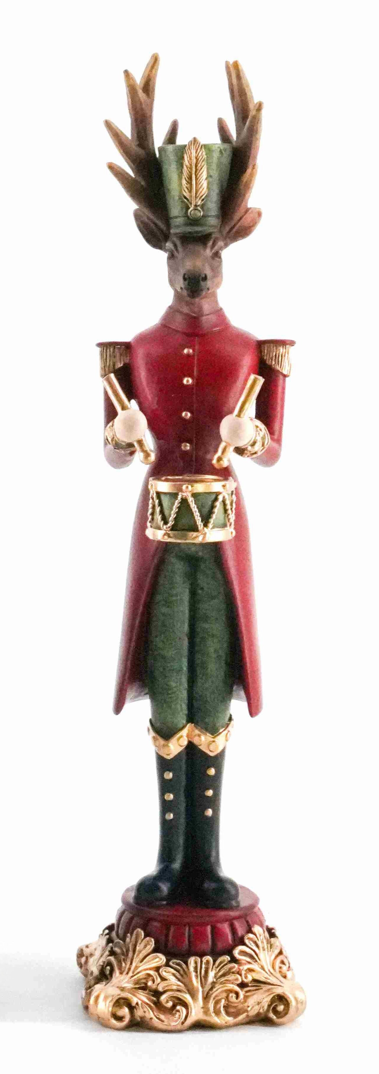 Majestic reindeer figurine dressed as a drummer in red and green uniform with gold accents