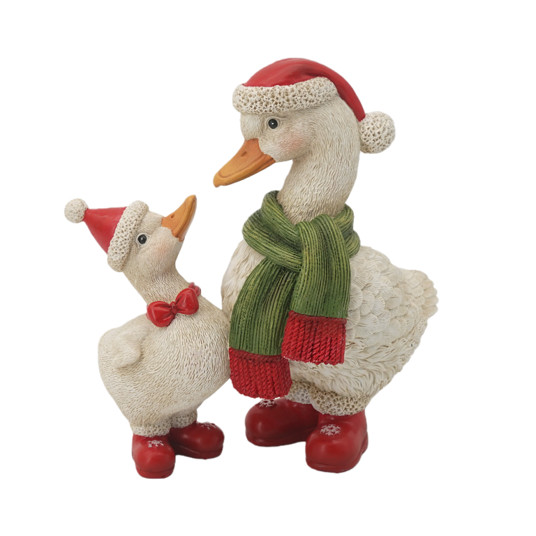 Mother and baby duck in Santa hats and red boots Christmas figurine, mother with a green scarf and baby with a red bow tie