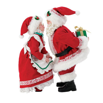 Santa and Mrs Claus figurine set in matching red and white festive outfits, standing together
