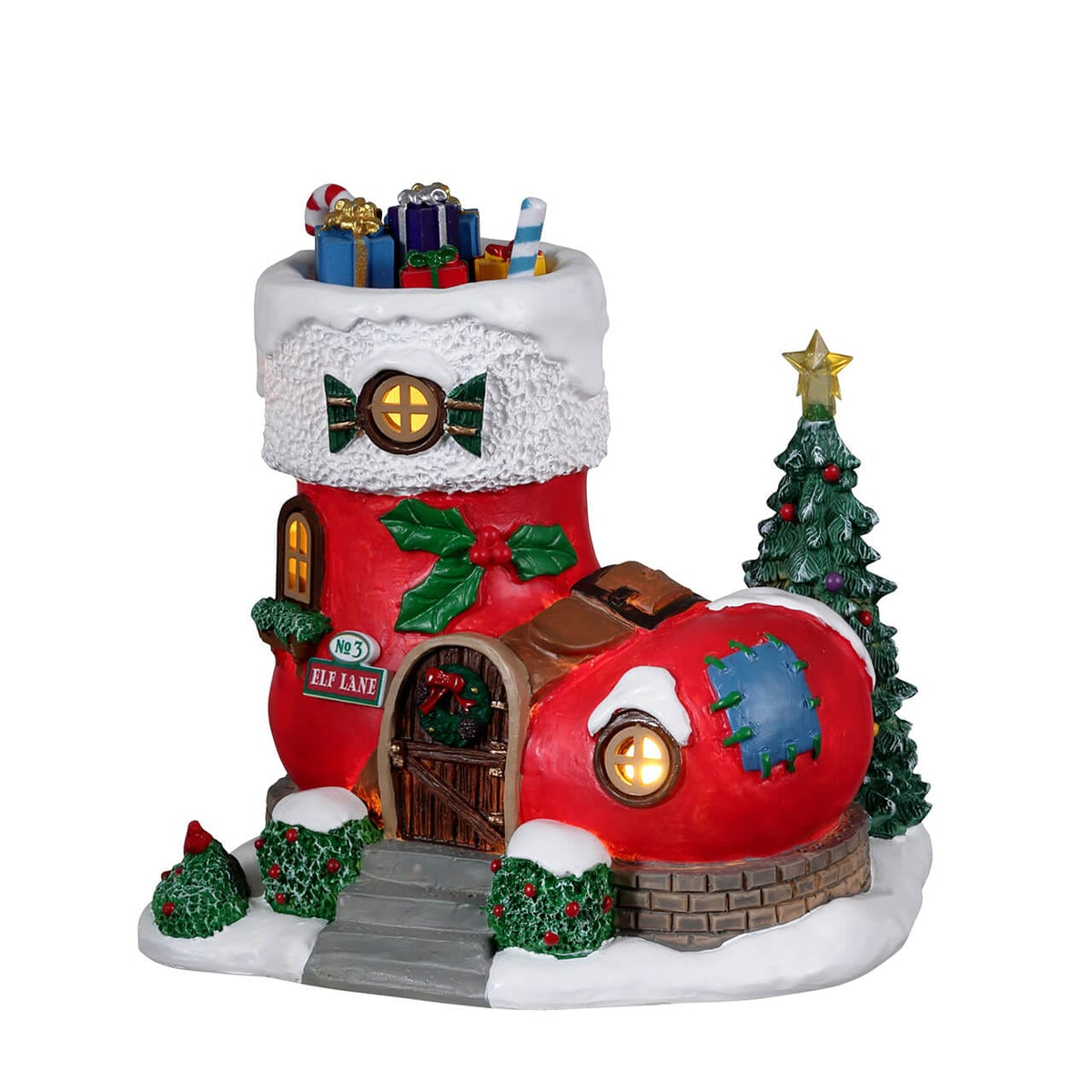 Rear angle view of Lemax stocking-shaped Elf Lane house with decorated tree and gifts