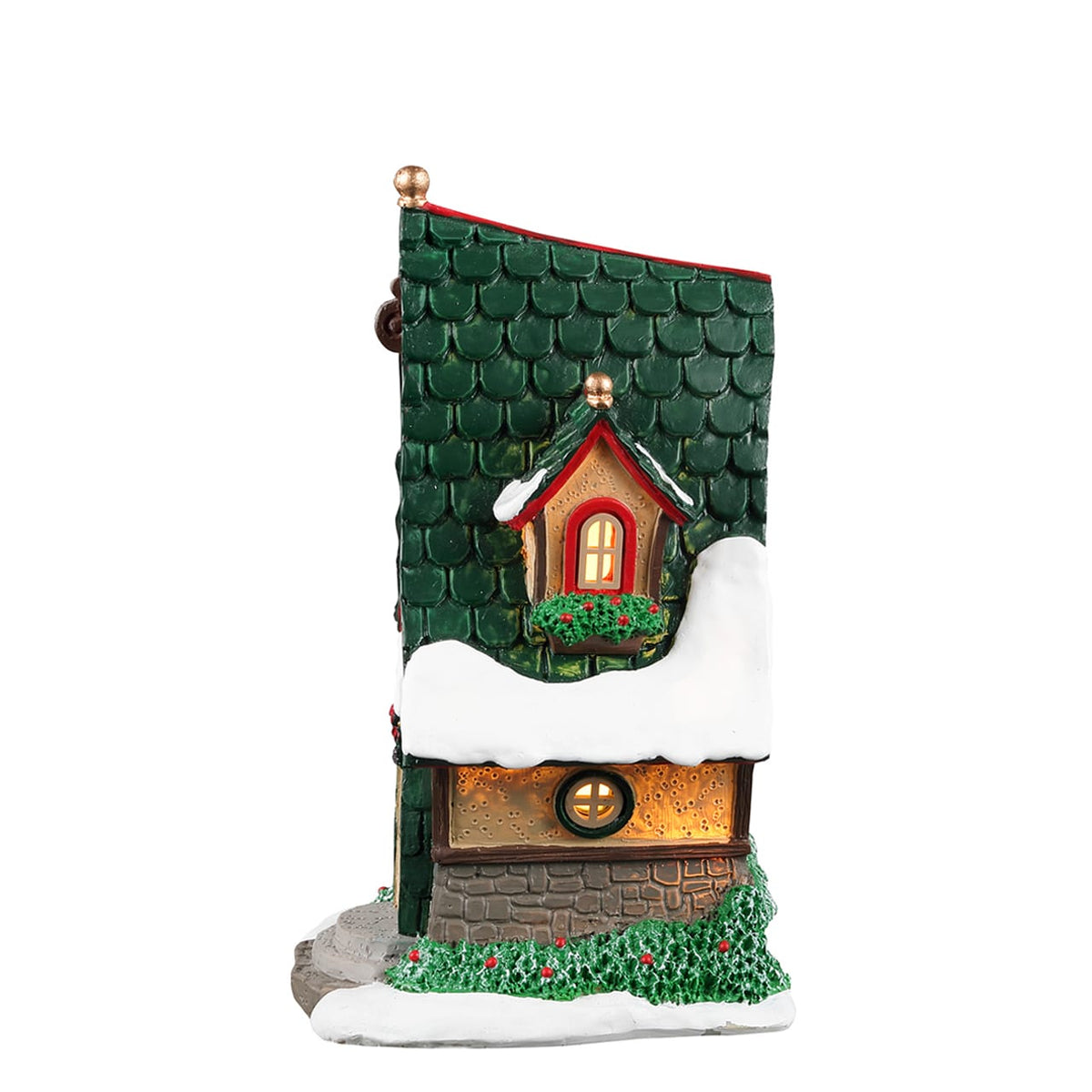 Side angle view of Lemax elf house with green shingle roof and lit dormer window