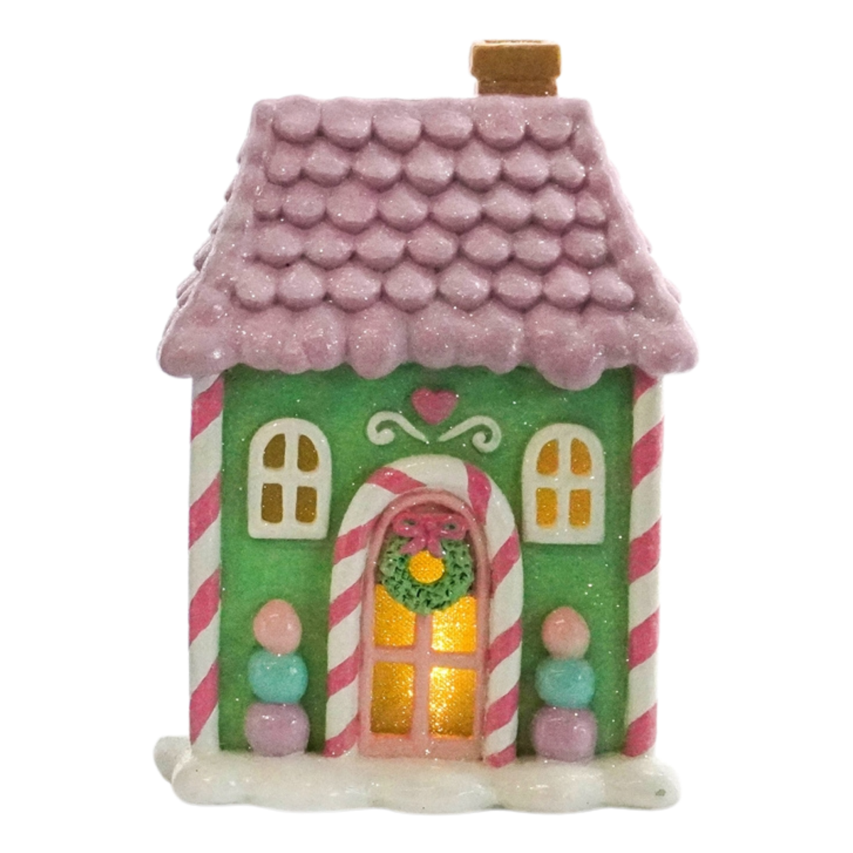 Pastel green candy house with a lilac-pink roof, candy cane arch and glowing amber windows