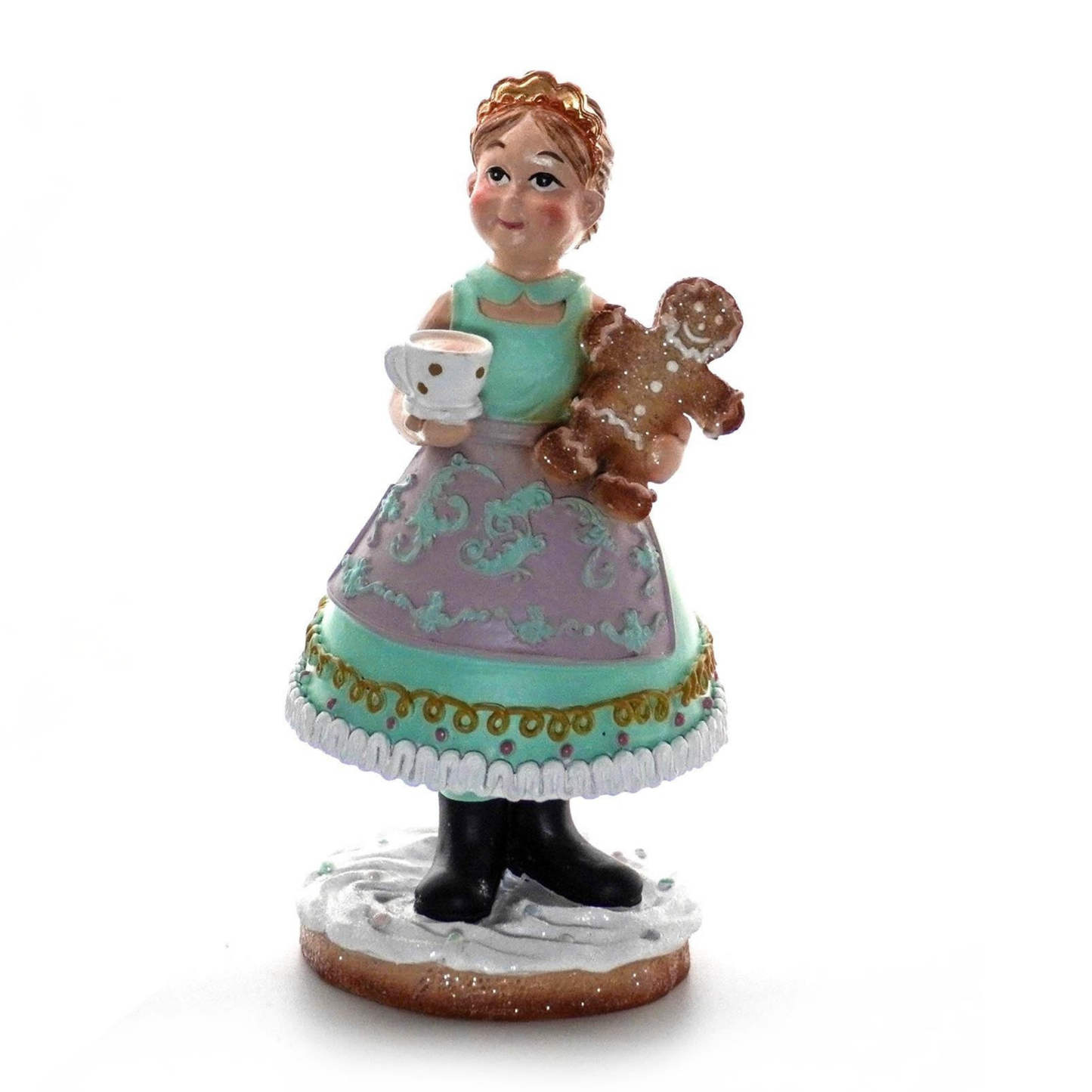 Pastel Mrs. Claus figurine holding gingerbread man cookie in soft holiday colors Christmas decoration