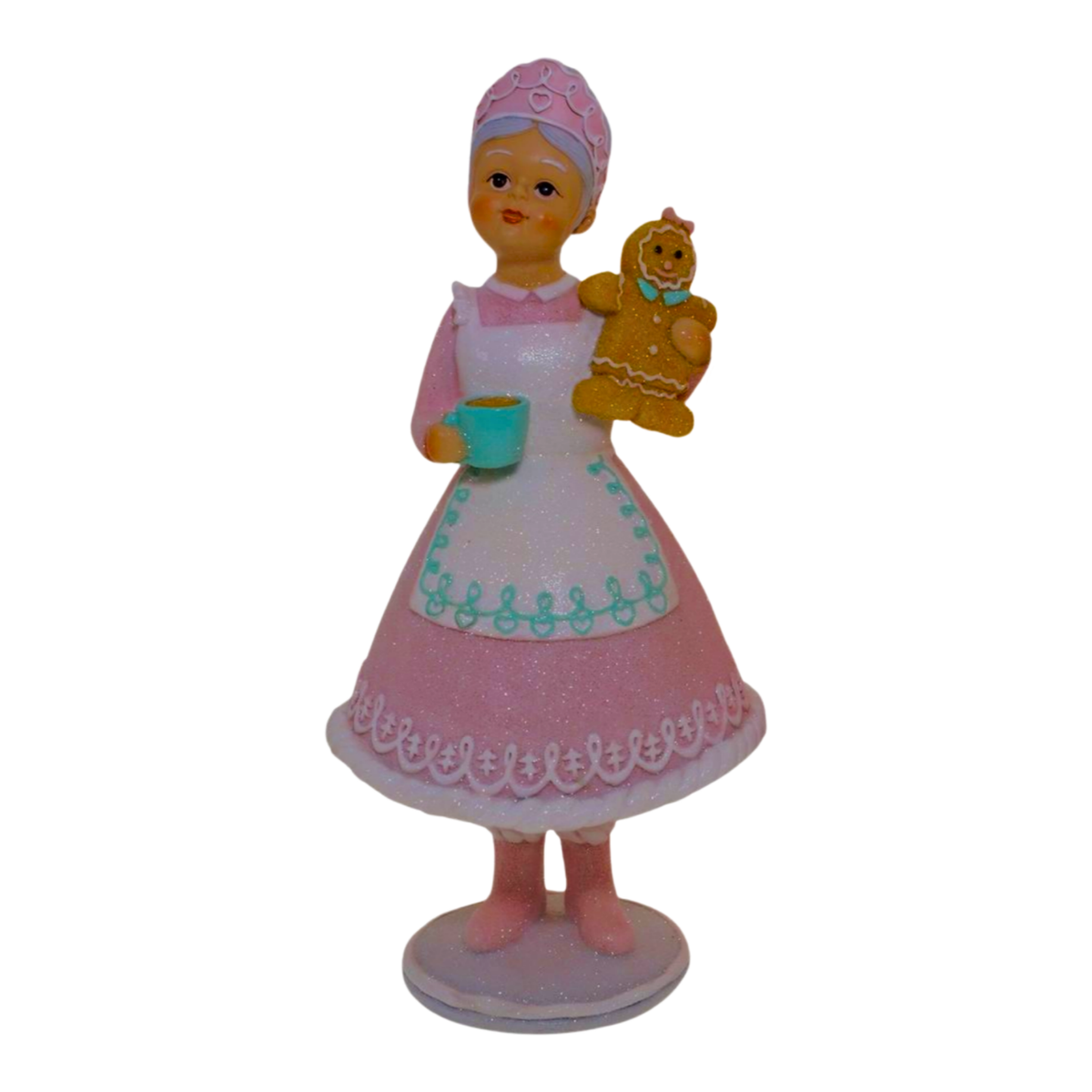 Pastel pink Mrs Claus figurine holding a mug and gingerbread woman