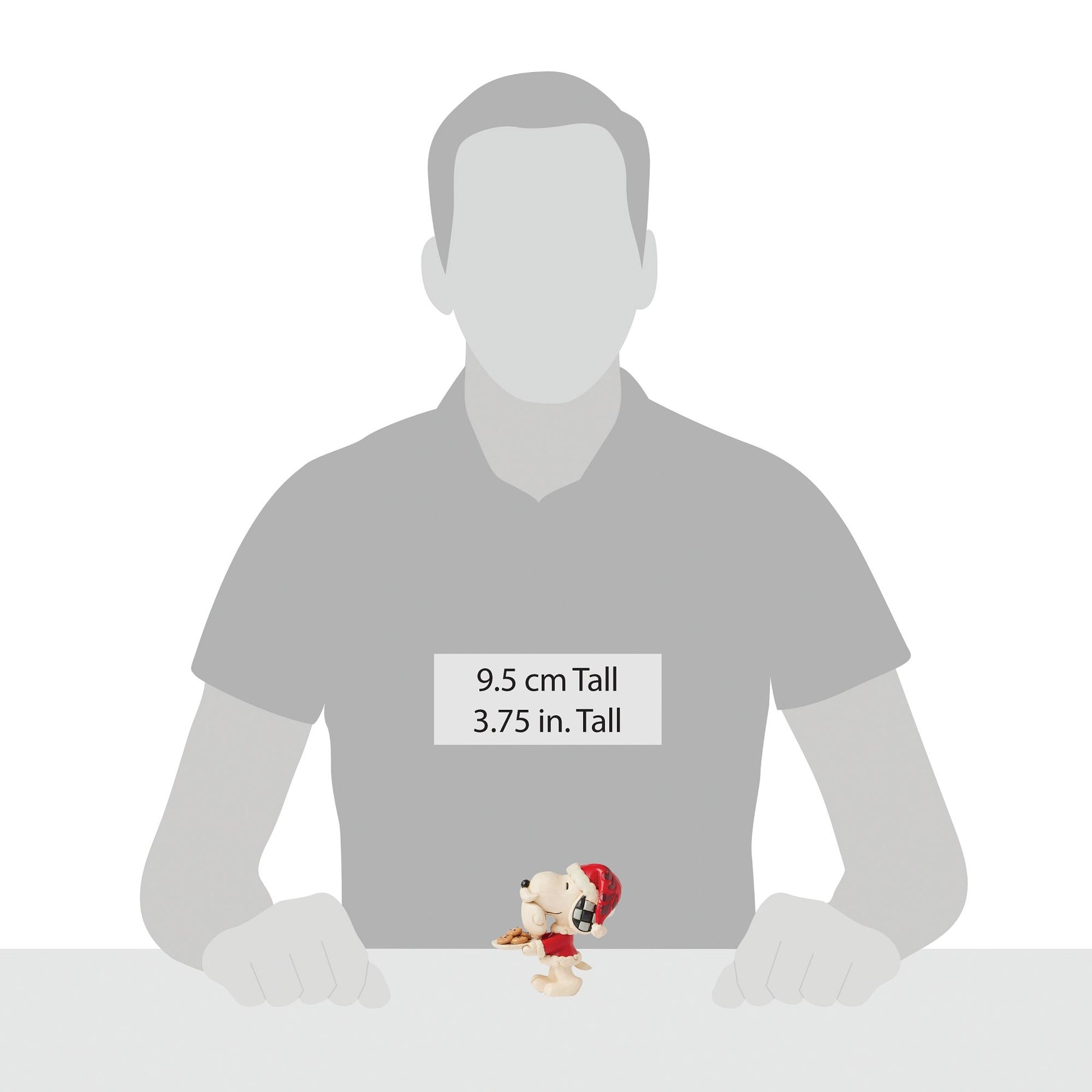 Scale reference Snoopy elf figurine shown beside human silhouette for scale, measuring 9.5 cm / 3.75 inches tall