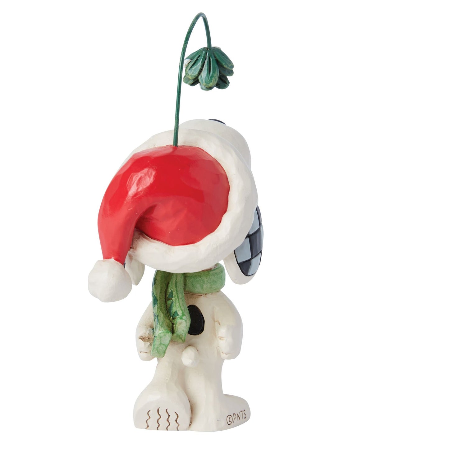 Rear view of Snoopy figurine in Santa hat and green scarf, holding mistletoe on a wire, checkered ear detail