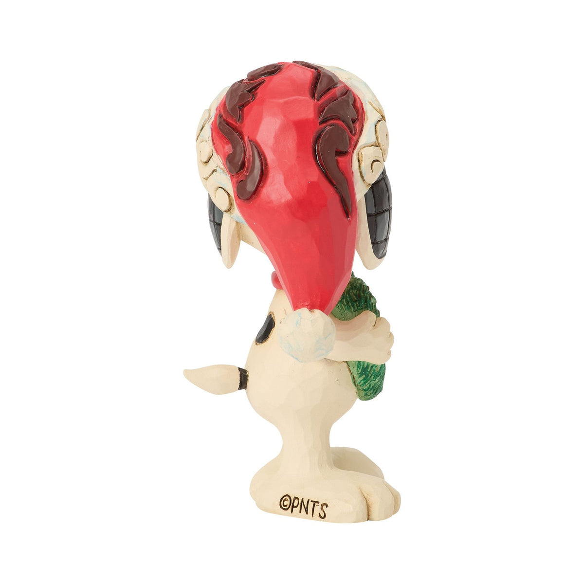 Left front angle of Snoopy Christmas figurine in red scrollwork Santa hat with pompom, green heart-shaped wreath held at chest 