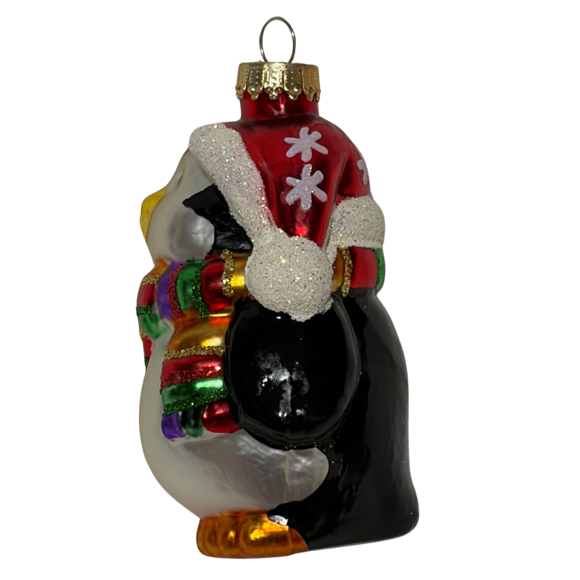 Penguin Christmas tree decoration wearing a red Santa hat and colourful striped scarf