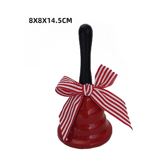 Red bell with a black handle and red and white striped bow on a white background