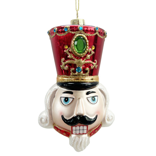 Red and gold nutcracker head glass ornament with jewelled hat, green gem centrepiece and classic painted face