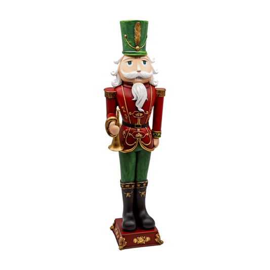 Red and green nutcracker soldier decoration holding a gold bugle, with gold detail, black boots and tall green hat with feather.