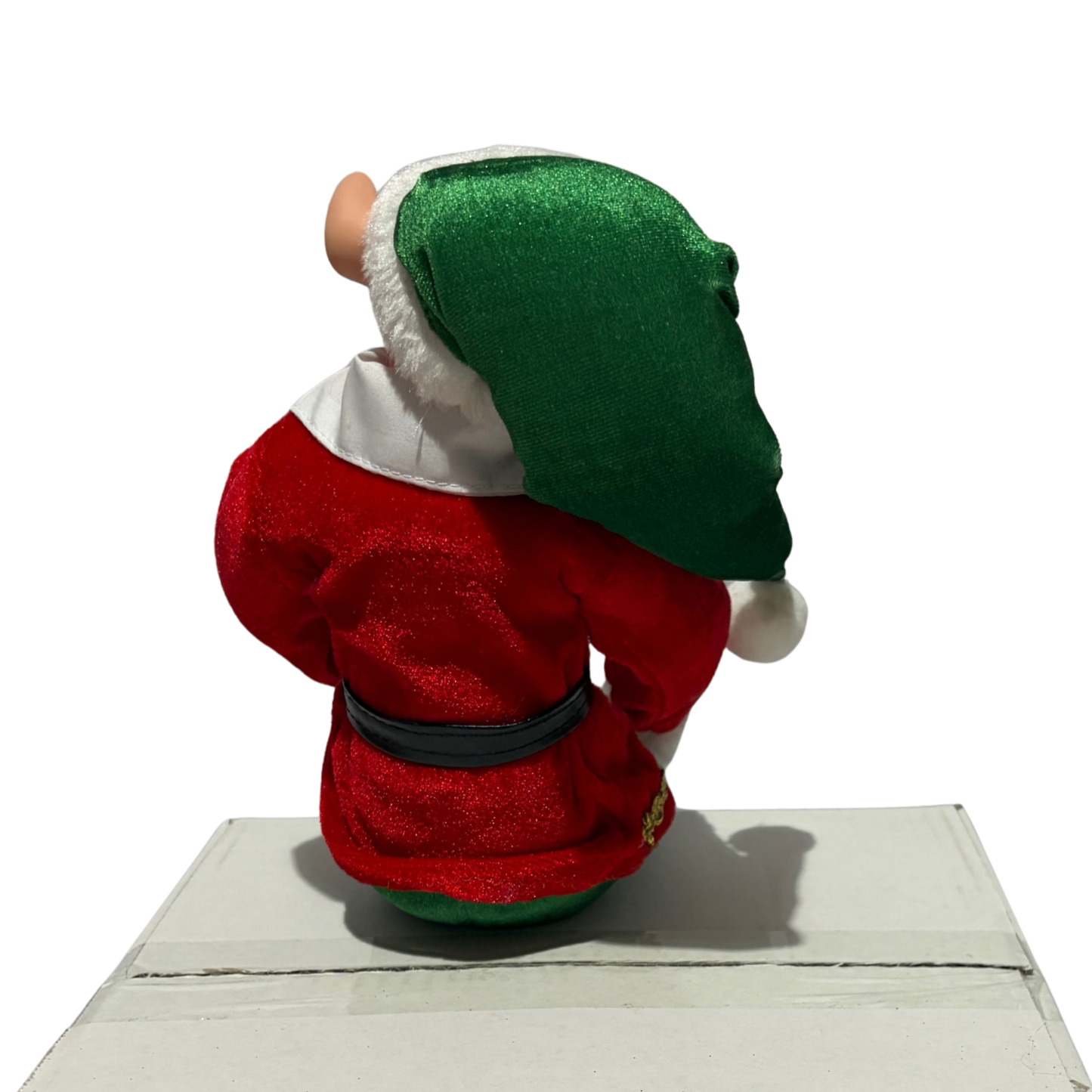 Sitting Christmas elf in red jacket and green trousers with a green hat and black boots
