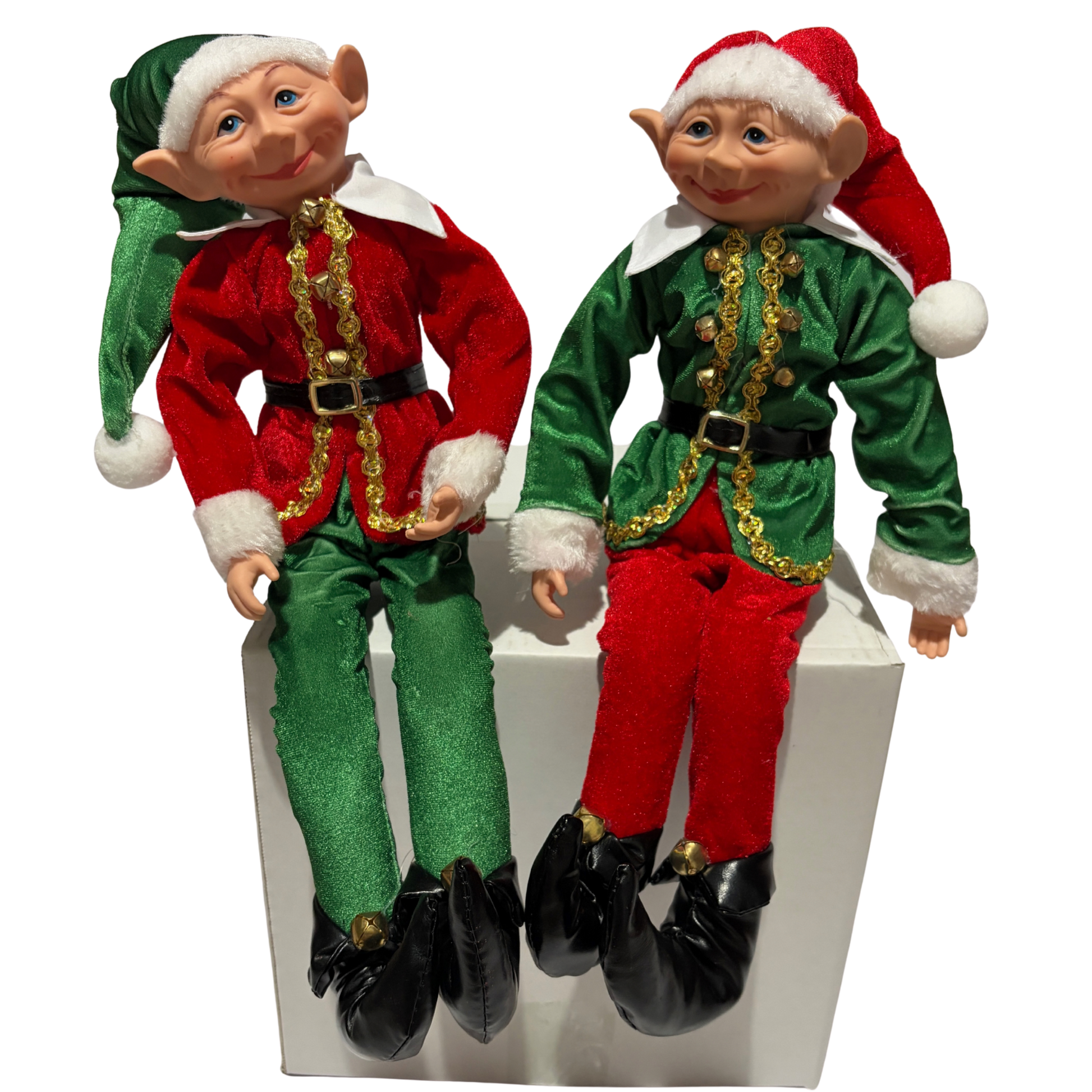 Two Christmas elves in red and green outfits with Santa hats on a white background