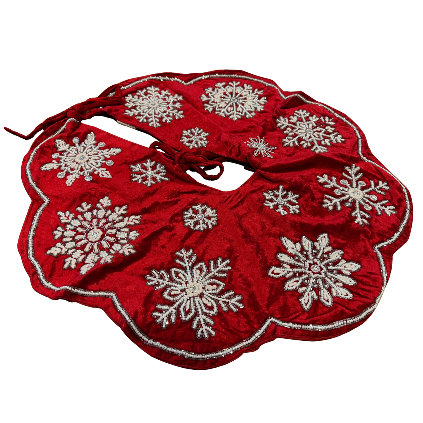 Hand-beaded red velvet Christmas tree skirt with silver snowflake designs