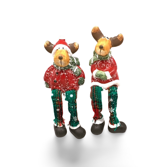 Two festive reindeer shelf sitters with antlers, red sweaters, plaid green and red dangling legs, and snowy accents.