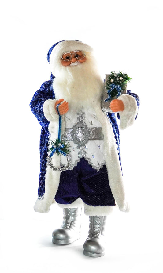 Royal blue and silver Santa Claus figurine holding a gift and ornament