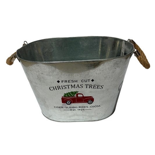 Metal Christmas tub with rope handles, decorated with a vintage red truck carrying a Christmas tree