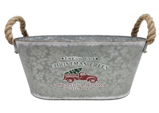 Metal Christmas tub with rope handles, decorated with a vintage red truck carrying a Christmas tree