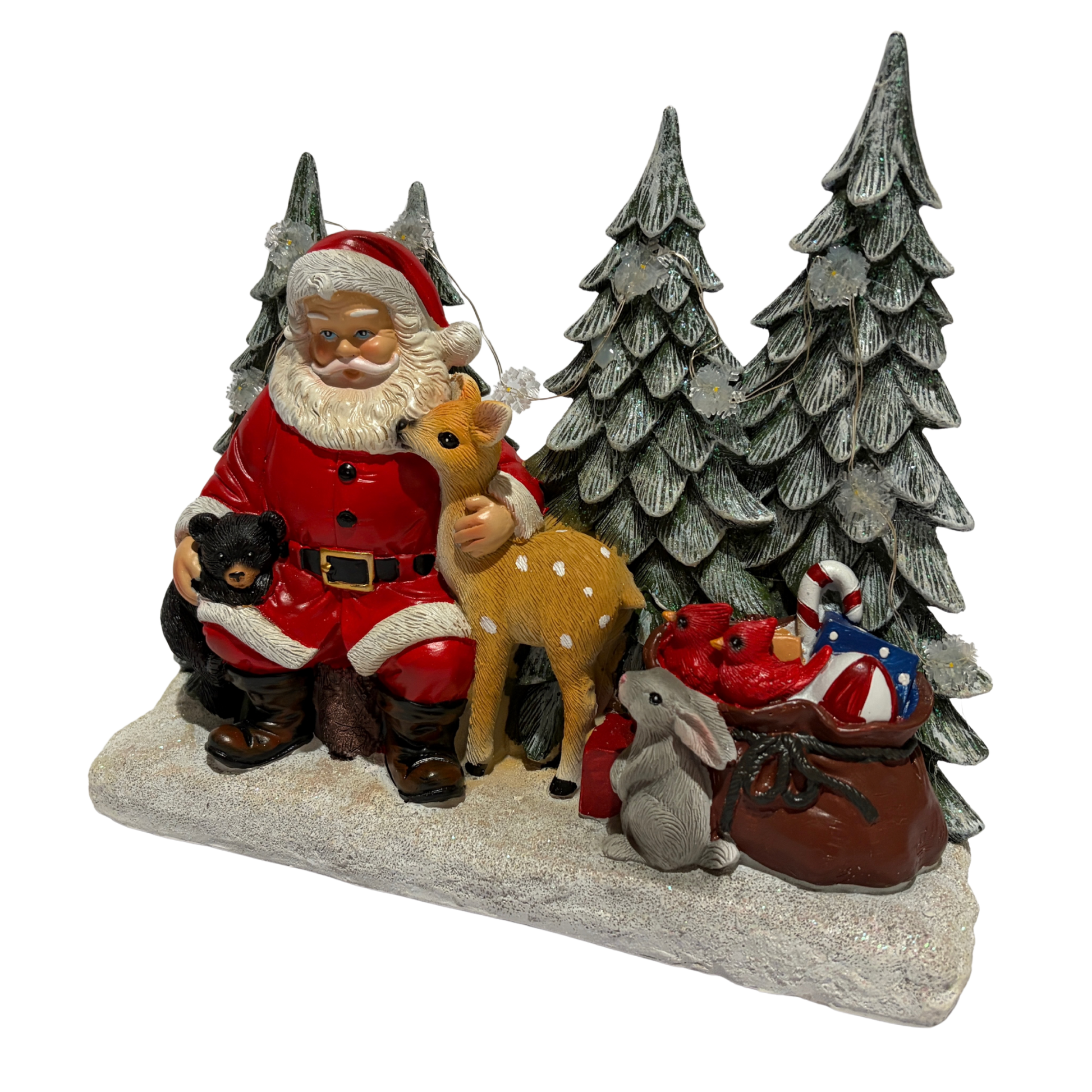 Santa sitting in a snowy forest with deer, rabbit, fox, and bear cub surrounded by pine trees