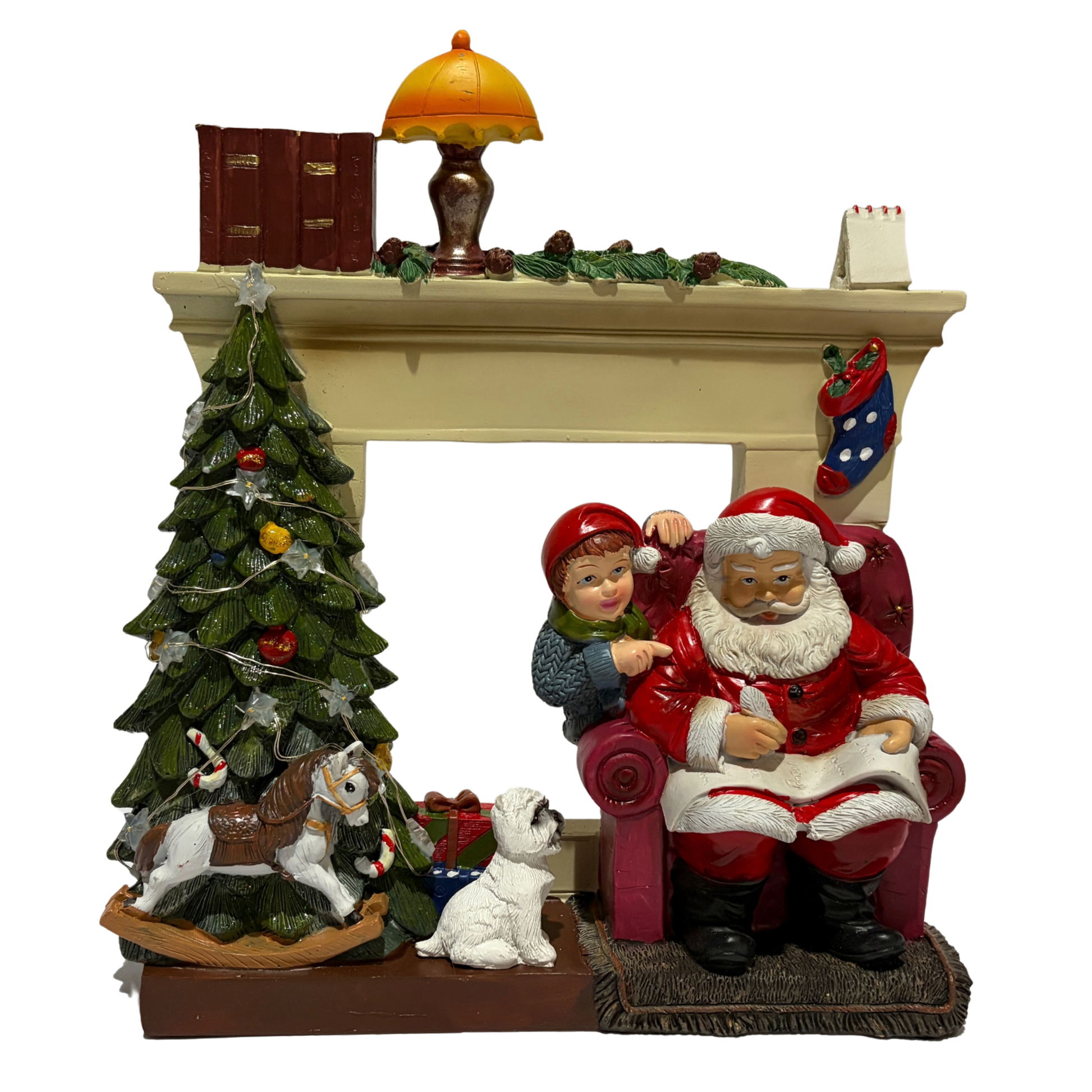  Santa sitting in an armchair beside a Christmas tree and fireplace with a child and dog nearby