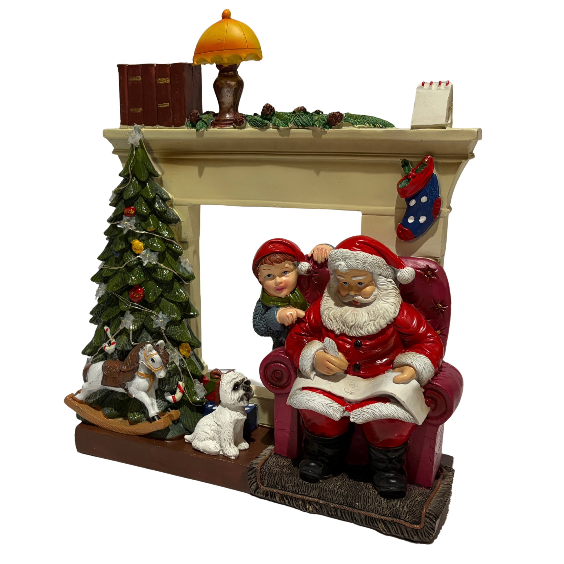  Santa sitting in an armchair beside a Christmas tree and fireplace with a child and dog nearby