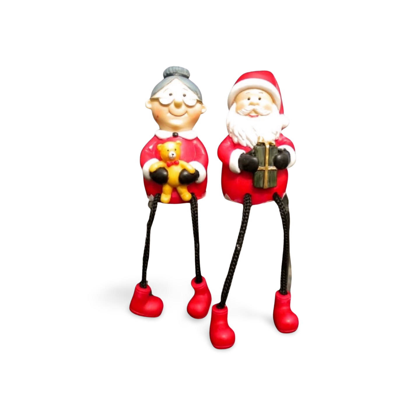 Santa and Mrs. Claus shelf sitter figurines with red outfits, dangling rope legs, Santa holding a present, and Mrs. Claus holding a yellow teddy bear.