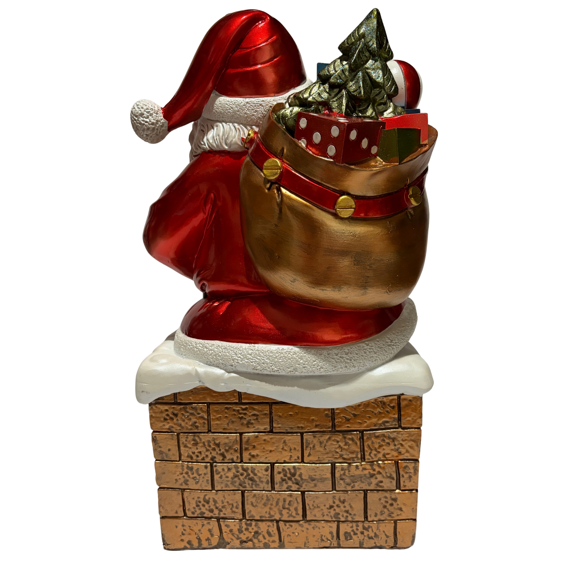 Santa ornament sitting on a snow-covered chimney holding a sack of toys