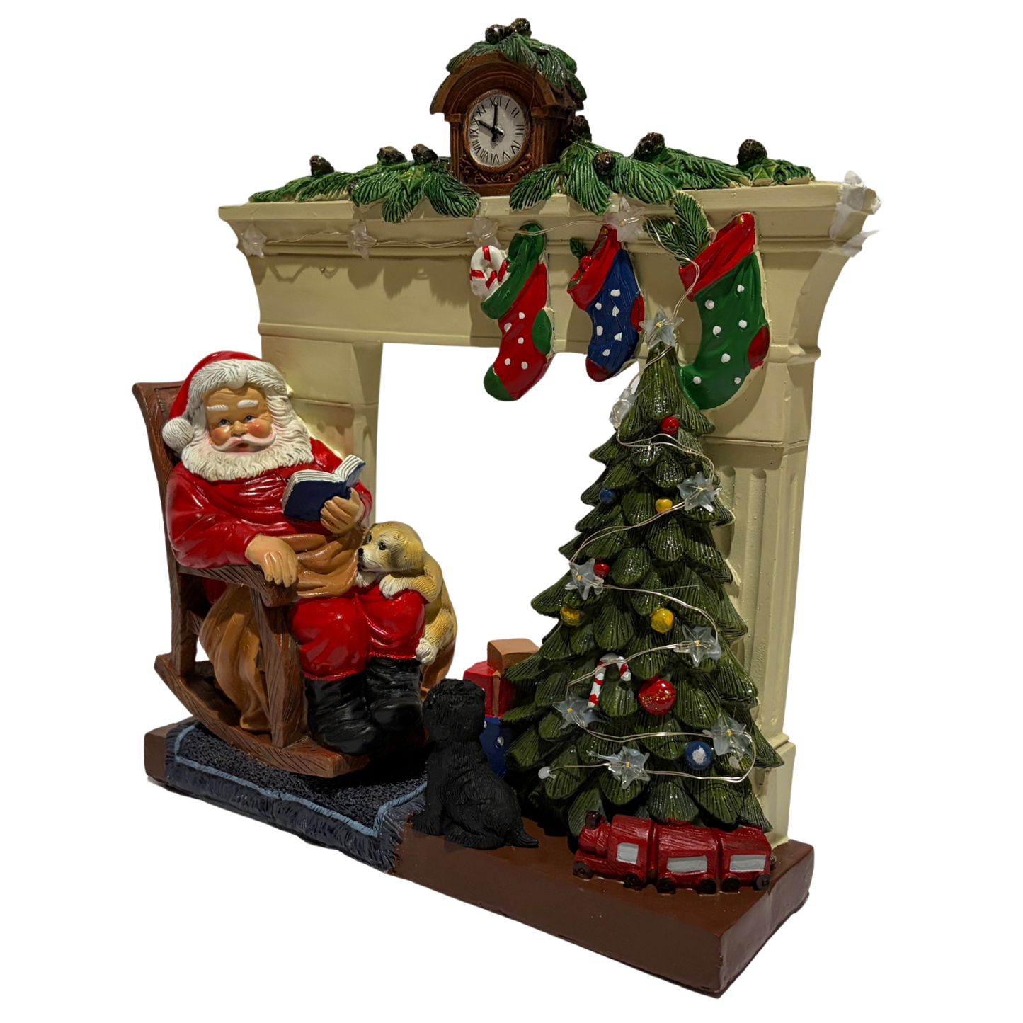 Santa sitting in a rocking chair beside a Christmas tree and fireplace with stockings and a puppy on his lap