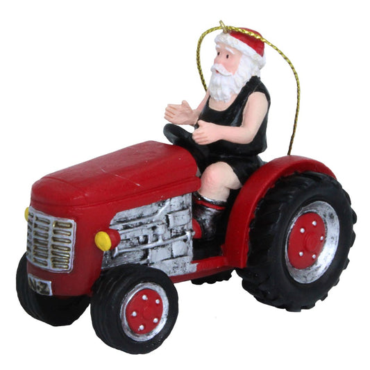 Santa in a black singlet and shorts riding a red NZ tractor hanging Christmas ornament