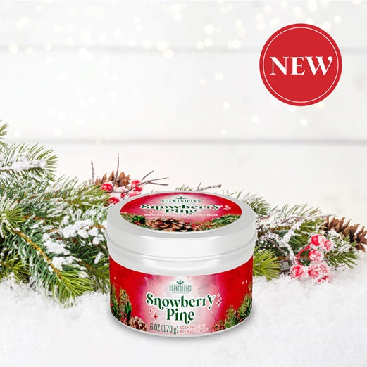 Jar of 'Snowberry Pine' with festive design on a snowy background
