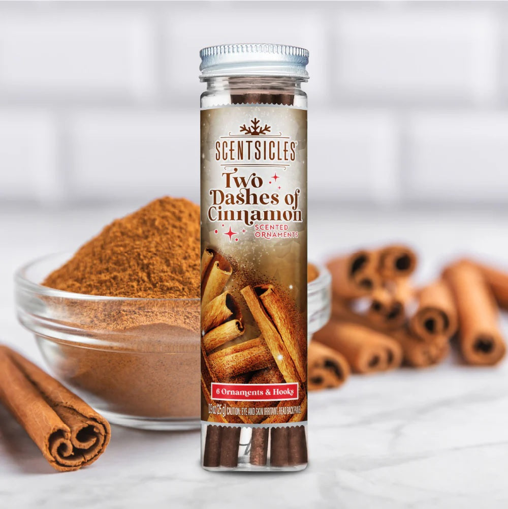 Scentsicles cinnamon flavored product with cinnamon sticks and ground cinnamon on a white background
