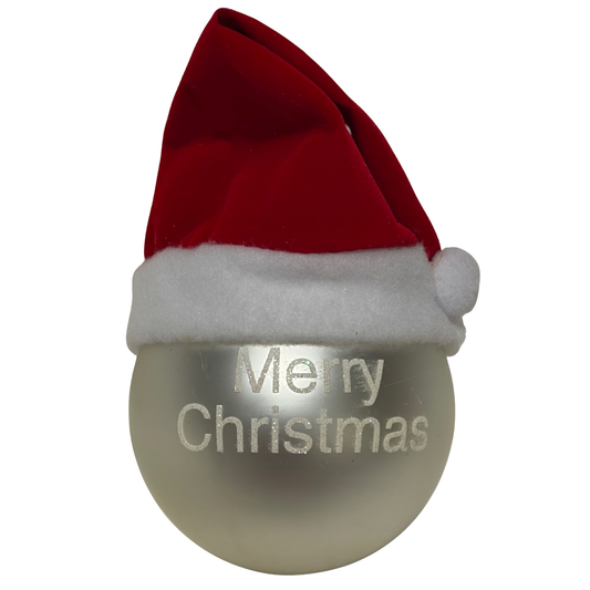 Silver Christmas bauble with white “Merry Christmas” text and a red Santa hat on top