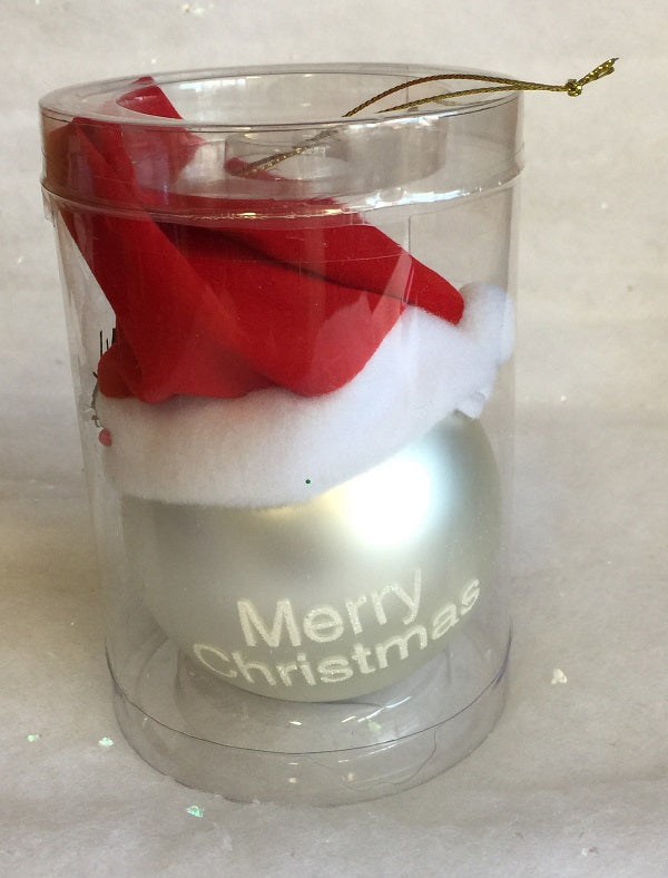 Silver Christmas bauble with white “Merry Christmas” text and a red Santa hat on top