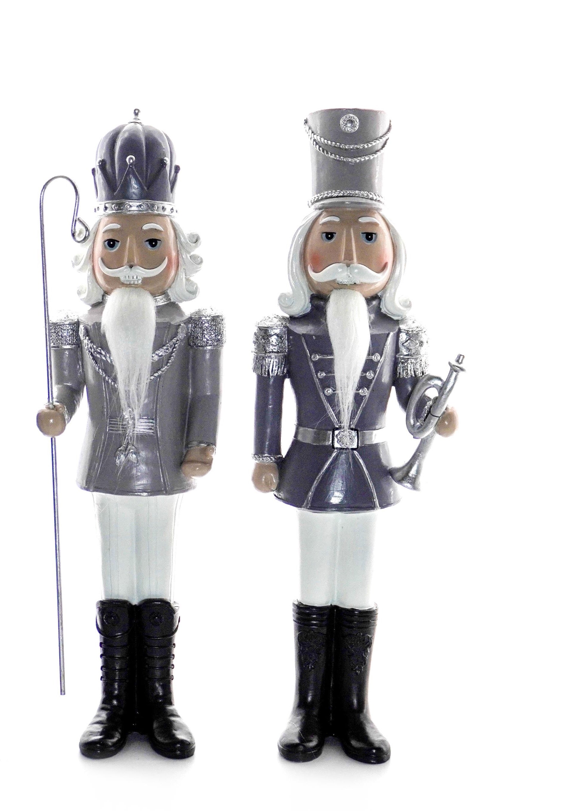 Silver nutcracker soldier holding a tall silver staff, wearing silver jacket and crown
