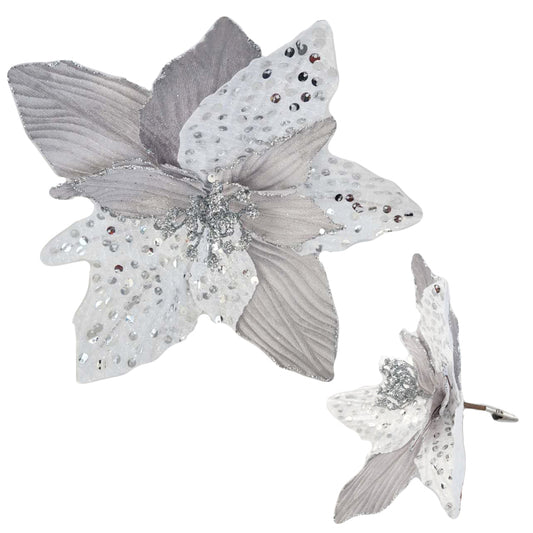 Silver and white poinsettia flower with sequins and glitter, attached to a metal clip