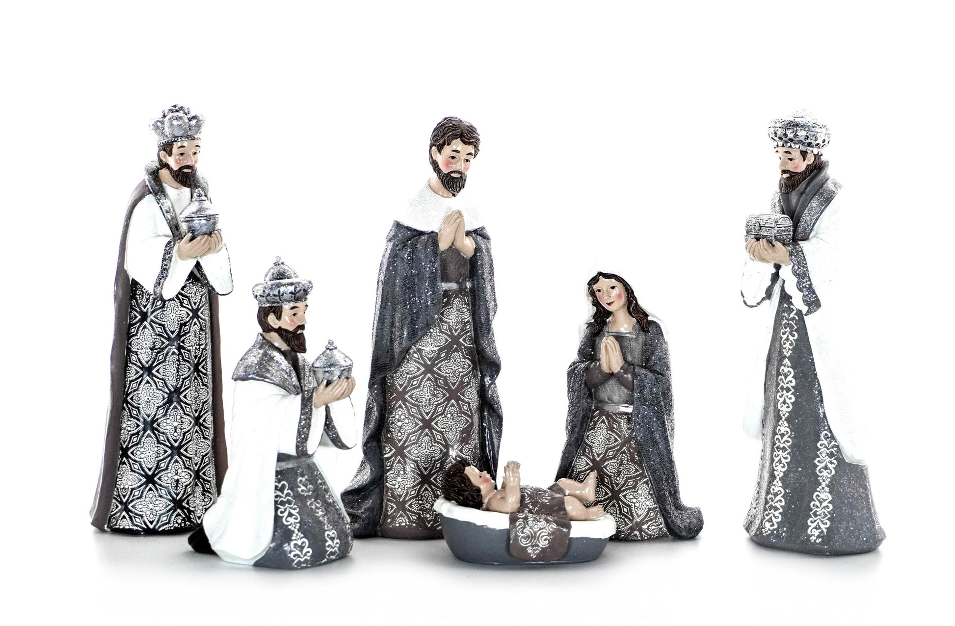 Silver and white nativity scene with Mary, Joseph, Baby Jesus, and Three Wise Men in patterned robes