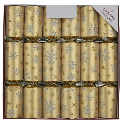 Box of gold Christmas crackers with silver snowflake patterns