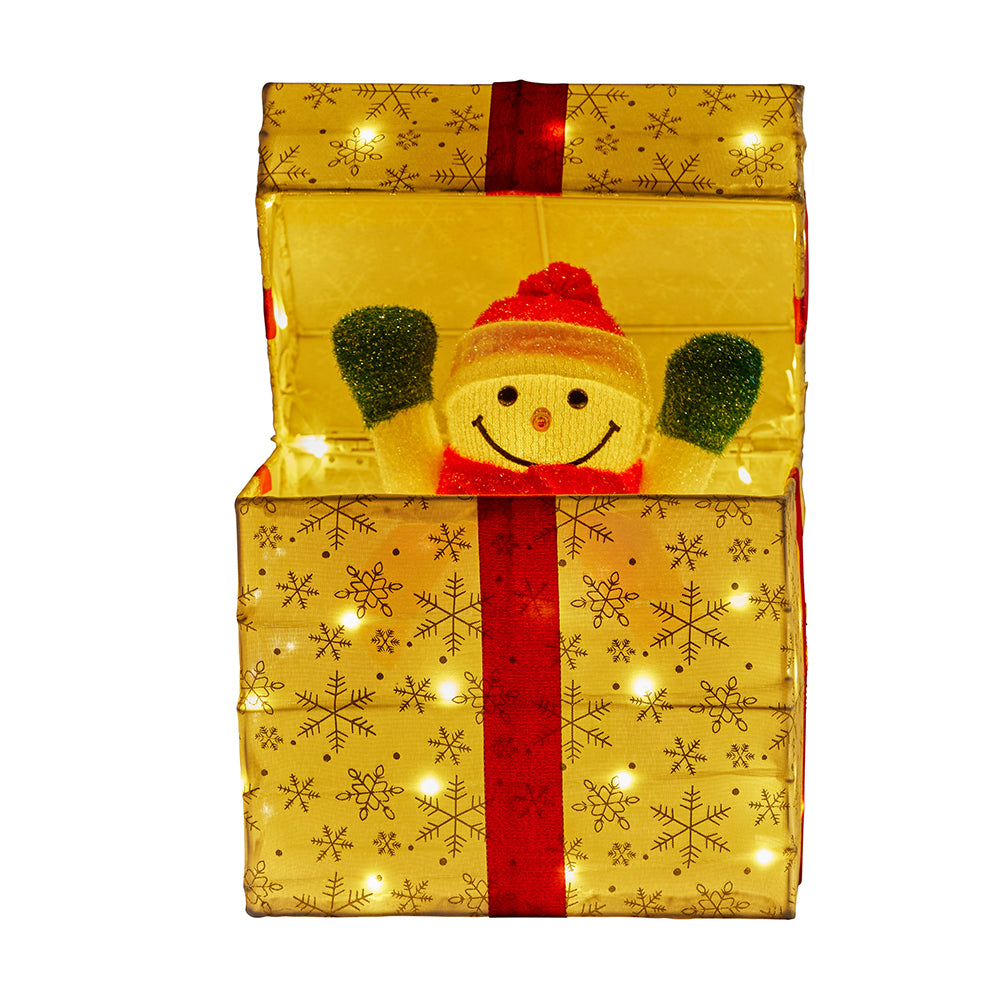 Gold LED light-up gift box decoration with snowman popping out and snowflake detail, lit