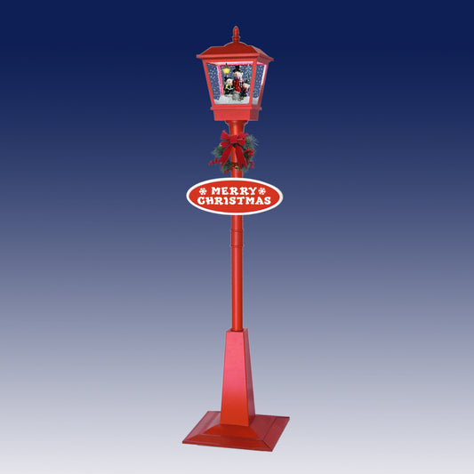 Red musical snowing lamp post with snowman scene, Merry Christmas sign and festive wreath decoration
