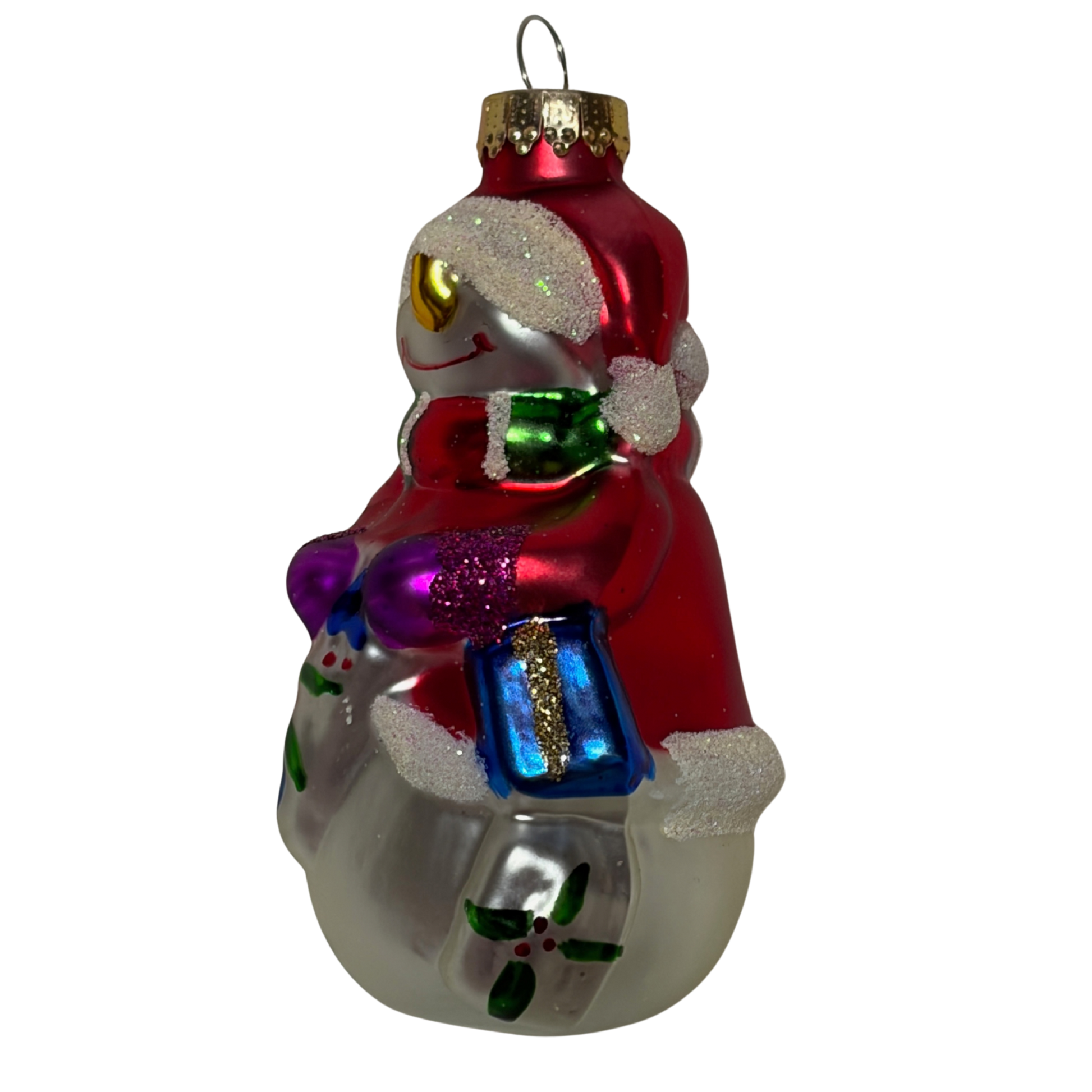 Snowman Christmas tree decoration wearing a red Santa hat and mittens, holding colourful presents
