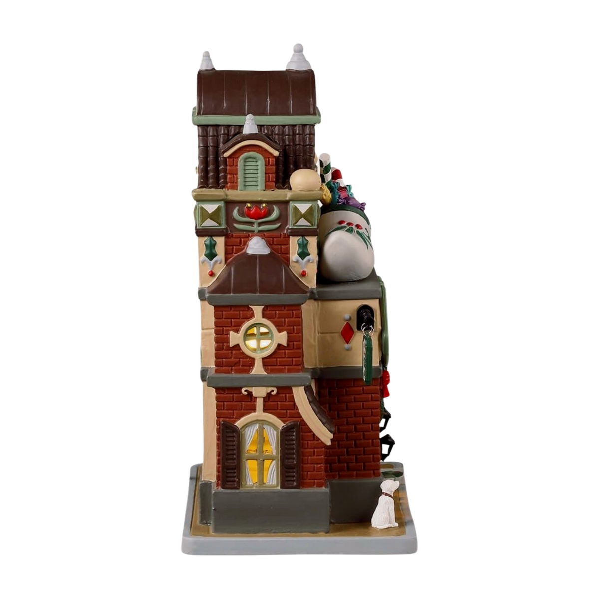 Side view of St. Nick's Wooden Shoe Shop Christmas village building with illuminated oval window and candy cane rooftop display