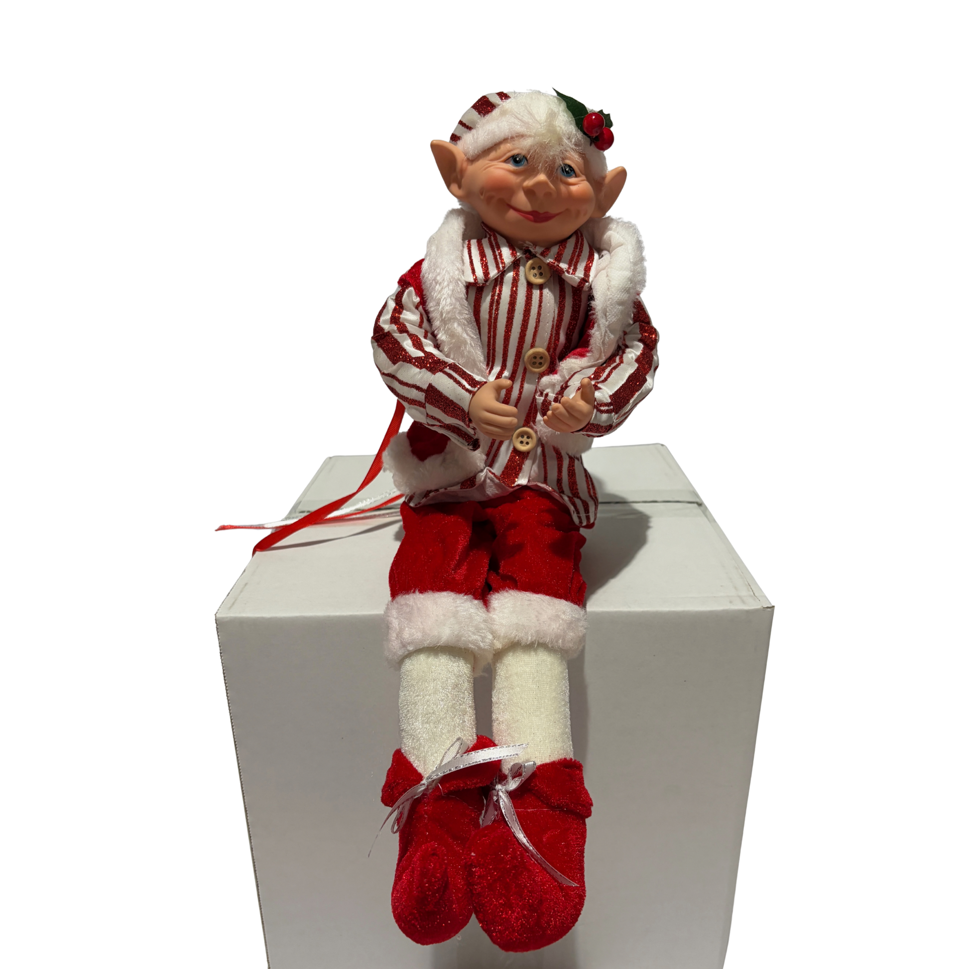 Sitting Christmas elf in red-and-white striped jacket and hat with white trim and red boots